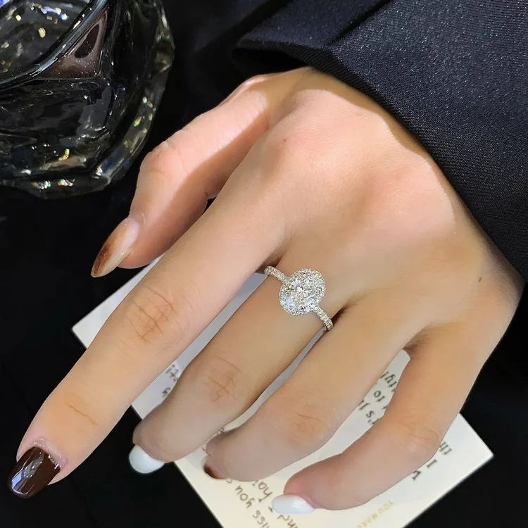 1 Carat Oval Lab Diamond Halo Solitaire Half Pave Engagement Ring in 18K White Gold