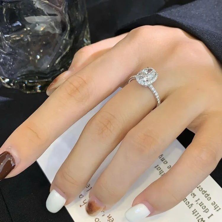 1 Carat Oval Lab Diamond Halo Solitaire Half Pave Engagement Ring in 18K White Gold